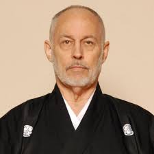 My school is Lóngjīng 龍晶 (Dragon Crystal). I began my studies under Hanshi  Masahito Nishida in Washington DC in 1968, by 1971 became his Senior  Student and Chief Assistant Instructor, and morphed