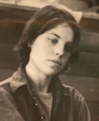 This young lady has a strong resemblance to my son. Guess who? 19ish. Most  of the time her hair was not so short. Perms were popular but this was a  fashion cut.