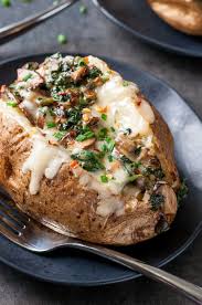 Cheesy Vegetarian Loaded Baked Potatoes With Spinach And Mushrooms Recipe Baked Potato Recipes Vegetarian Recipes Easy Spinach Stuffed Mushrooms