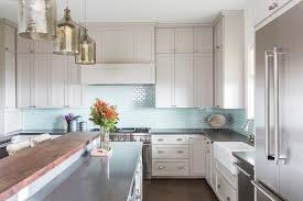 When choosing your backsplash material for your kitchen, the very first thing you need to keep in mind is grey & white marble subway tile. Light Gray Kitchen Cabinets With Aqua Mini Glass Tile Backsplash Transitional Kitchen