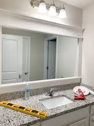 Mirrors are created when one side of a piece of glass is coated with silver nitrate, transforming it into a mirror. Diy How To Frame A Builder Grade Bathroom Mirror Home And Hallow