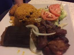 Divide among four individual plates, sprinkle with the chopped cilantro leaves, and serve with yellow rice. I Think It Was Called The Christmas Special Roasted Pork Puerto Rican Tamale Rice And Beans Picture Of El Jibarito Puerto Rico Tripadvisor