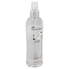 The perfume bottle is made out of glass with a blue tint to it. Bodycology Pure White Gardenia Moisturizing Body Lotion 12 Oz
