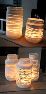 She Wrapped Her Empty Jars With Yarn And Then Put This Inside The Result Jaw Dropping Yarn Diy Painted Jars Jar Diy