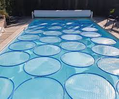 Heat your pool by harnessing the power of the sun with this easy tutorial using a pool noodle, hula hoop and a trash bag. Heat Your Pool With Solar Lily Pads 4 Steps With Pictures Instructables