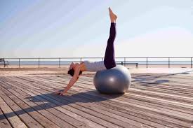 Try These Yoga Poses Using An Exercise Ball Ball Exercises Exercise Workout Videos