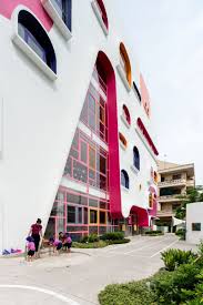 Facade Ideas The White Facade Of The Kindergarten Features Pops Of Color That Complement The Colo Colour Architecture Facade Architecture Window Architecture