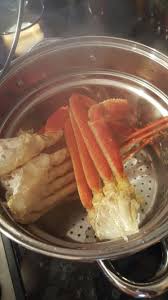 Cook the garlic in the butter until translucent; Steamed Snow Crab Legs Seasoned With Adobo And Served With Melted Butter Cooking Crab Legs Crab Legs Recipe Crab Leg Recipes Boiled