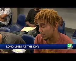 Image of someone waiting in a long DMV line, looking exasperated
