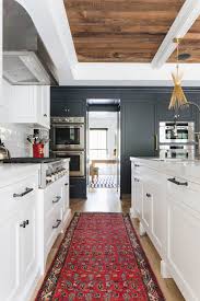 The cabinets are made with a traditional farmhouse structure in mind, but their painted grey cabinets, white stone countertops, and subway tile backsplash keep the look fresh. 1001 Ideas For A Modern Farmhouse Kitchen Decor