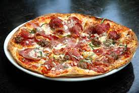 Crispy Thin Crust Pizza Topped With Italian Sausage Spicy Capicola Ham Salami Mozzarella Shaved Parmesan Basil And Or Handmade Pizza Cooking Recipes Food