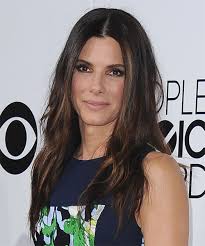 The following year, it was blonde curls and barrettes at the blockbuster awards. Sandra Bullock Long Straight Dark Brunette Hairstyle With Light Brunette Highlights