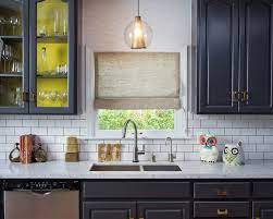 Add a hanging lamp above the countertop to maximise the potential of this space. Navy Cabinets Eclectic Kitchen House Of Honey
