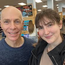 Kadey and I spent yesterday getting haircuts and shopping. (This pic was at  Trader Joe's, where we both got enough food to survive an apocalypse.) I  know what you're thinking—"Bill, you don't