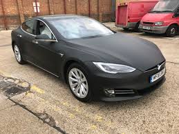 This gloss black model x tesla was wrapped in satin black with a matte grey marbek style camo design. Tesla Wrap London