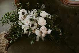 Beautiful large meadow flower wreath of mixed artificial meadow flowers in white and green with a lovely assortment of greenery on a wicker base. Simple White And Green Wedding Bouquet With Vines And White Flowers By Jess Craven
