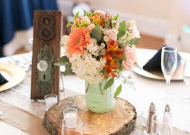 Maybe you would like to learn more about one of these? Wood Slab Centerpieces With Mint Mason Jars And Doorknob Table Numbers