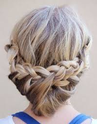 Dutch braid the hair along one side of your head and wrap the end of the braid to shape a loose low bun. 12 Latest And Easy Updo Hairstyles For Medium Hair I Fashion Styles
