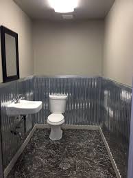Not only will they last virtually forever, they have a rustic country charm that cannot be denied. Rustic Bathroom With Corrugated Metal Novocom Top
