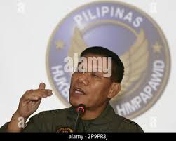 Southern Philippines military chief Lt. General Alberto Braganza, left, and  Army Col. Nehemias Pajarito inspect a fox hole inside a captured camp of  the Muslim extremist group Abu Sayyaf Friday, Feb. 25,