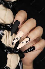 Premium Photo Beige And Black Manicure On A Long Nail Shape