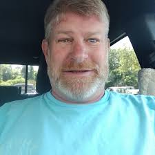 Are there free public beaches near the Cozumel port?