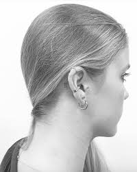 I have 2 tattoos already, one between my shoulder blades and one on my rib cage. 11 Tiny Tattoo Ideas For Behind Your Ear From Celebrity Tattoo Artists Glamour