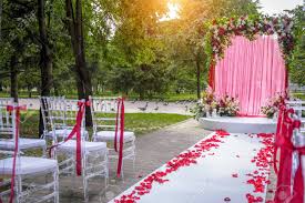 Maybe you would like to learn more about one of these? Wedding Ceremony On A Summer Day In The City Park Among The Green Foliage White Carpet Chairs Decorated With Red Ribbons Stock Photo Picture And Royalty Free Image Image 146761984