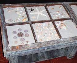 Since it's been raining for two days, i thought i'd stay inside and show you one of the ways i have displayed some of the shells clark and i have collected while on vacation. Coastal Wall Decor Ideas With Old Window Frames Old Window Frames Window Crafts Coastal Wall Decor