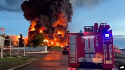 Emergency services respond to the scene of a vehicle explosion in Sevastopol, Crimea.