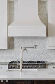kitchen with carrera marble hex tiles