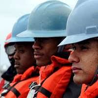 The Deck Department Sailors assigned to the amphibious command ship USS  Blue Ridge (LCC 19) fake out three shots of the starboard side anchor  chain.