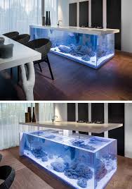 I've been obsessed with fish tanks and aquariums for quite awhile. Dutch Interior Designer Robert Kolenik Has Created A Kitchen Island That Includes An Aquarium Home Home Aquarium Design