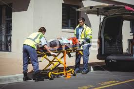 Photograph Ambulance Crew Bringing Injured Person Inside Ambulance Car 64152482 Ambulance Bring It On Person