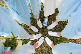 Red, white and something blue! Bridal Party Bridesmaids With White Sneakers On Grass Wearing Light Blue David S Bridal Bridesmaid Dresses And