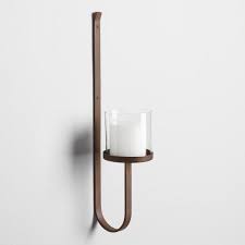Wall candle sconces can bring warmth to almost any room in a way that's different from the lighting effect you will create with electric lights. Antique Gold Metal Ariel Sconce Wall Candles Candle Sconces Wall Sconces