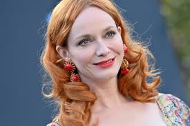 Christina Hendricks Turns Parisian Cafe Into Her Runway