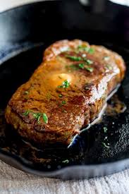 A Ribeye Steak In A Cast Iron Pan With Butter Melting Over It Easy Steak Dinner Beef Recipes Easy Steak Butter