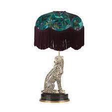 luxury table lamp set featuring the florika print made of british velvet with chainette fringing paired here with the charming che animal lamp lamp table lamp