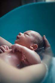 Baby wash and shampoo, which is specially formulated to not sting their eyes, and gently massage over their whole head. Newborn Baby Boy Taking A Bath With His Mother By Ivan Bastien Photographe