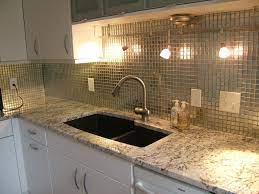 Kitchen backsplashes are no longer just for protecting walls from spills and splatters. Granite Countertops White Cabinets Metallic Backsplash Miami Circle Marble Fabrication In Atlan Metallic Backsplash Stainless Backsplash Modern Backsplash