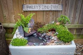 How To Create A Mini Dinosaur Garden Simon Orchard Garden Design Dinosaur Garden Garden Projects Garden Design