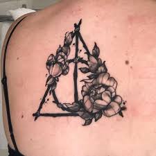 Deathly Hallows Tattoo With Flowers Harry Tattoos Harry Potter Tattoos Harry Potter Tattoo Sleeve