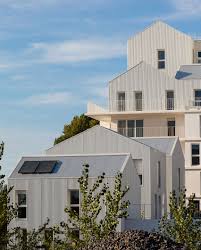 Gabled Penthouses Sit Atop Apartment Blocks At Bordeaux Housing Scheme Townhouse Exterior Architecture Exterior Architecture