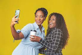 Two Friends African American Girls Take a Selfie or Video Call with Friends  on a Yellow Background. Video Chat, Video Conference Stock Photo - Image of  modern, model: 220406356