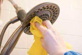 Mix a solution of equal parts white vinegar and water (you'll need about 1 cup), and pour it into a plastic bag. How To Deep Clean Your Bathroom Showerhead Unclog A Showerhead With Vinegar Hgtv