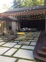 Square And Rectangle Concrete Forms With Turf Grass In Between Furniture Is From West Elm Concrete Backyard Concrete Patio Patio Extension Ideas