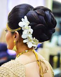 What A Beautiful Large Large Low Bun With Real Flower Gajra Care However Should Be Taken Before Adopting Suc Big Bun Hair Bun Hairstyles Indian Bun Hairstyles