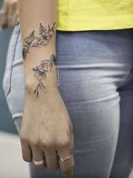 The demand for wrist tattoos has increased nowadays among modern women and girls. Flower Tattoo Wrap Around Wrist Pesquisa Google Flower Google Pesquisa Tattoo Wrap W Wrap Around Wrist Tattoos Simple Wrist Tattoos Wrap Around Tattoo