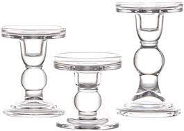 • a pair of candlestick holders or a pillar candle holder provides an elegant focal point. Amazon Com Clear Glass Candle Holder Set Of 3 Elegant Pillar Taper Tealight Candlesticks Set For Dinner Table Wedding Party Home Decor Home Kitchen